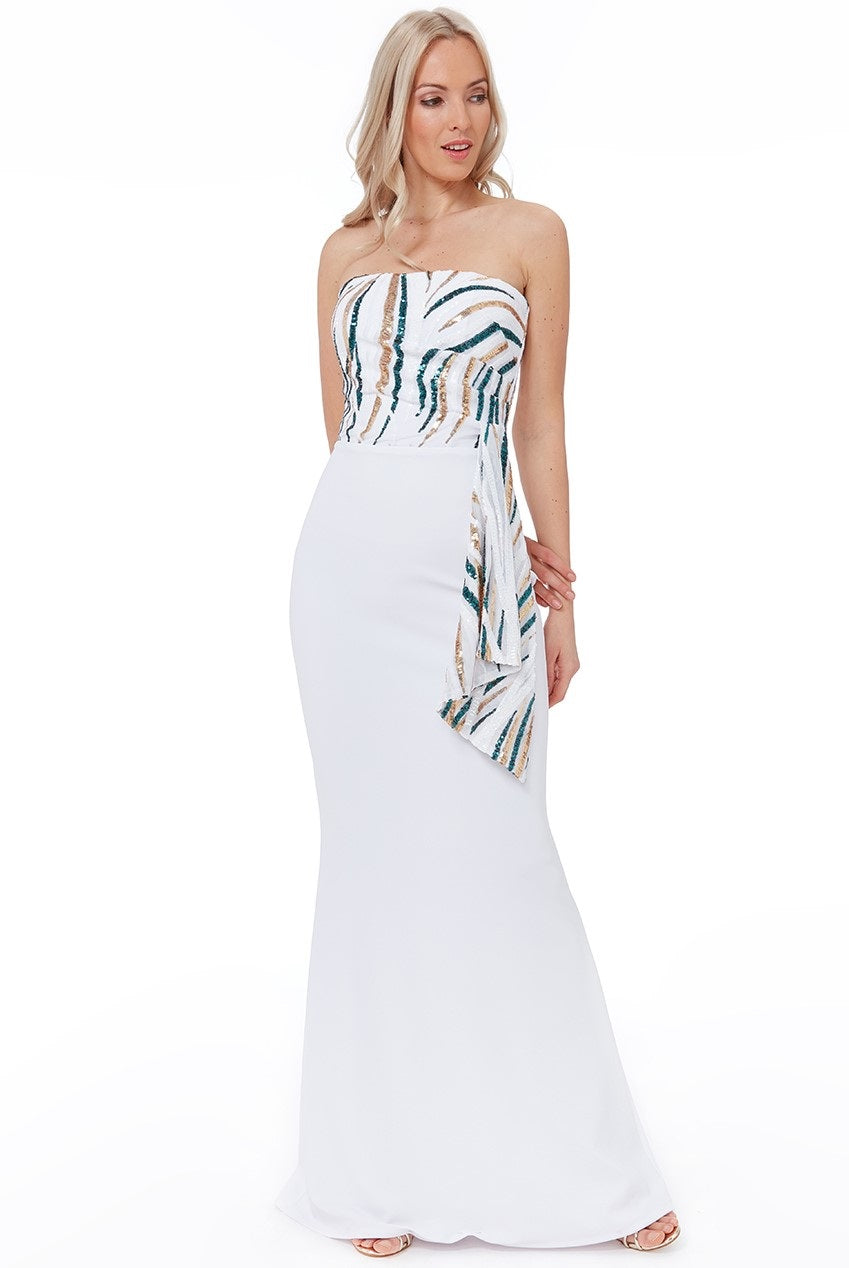 11070. White crepe with teal and gold detail. Size 10.