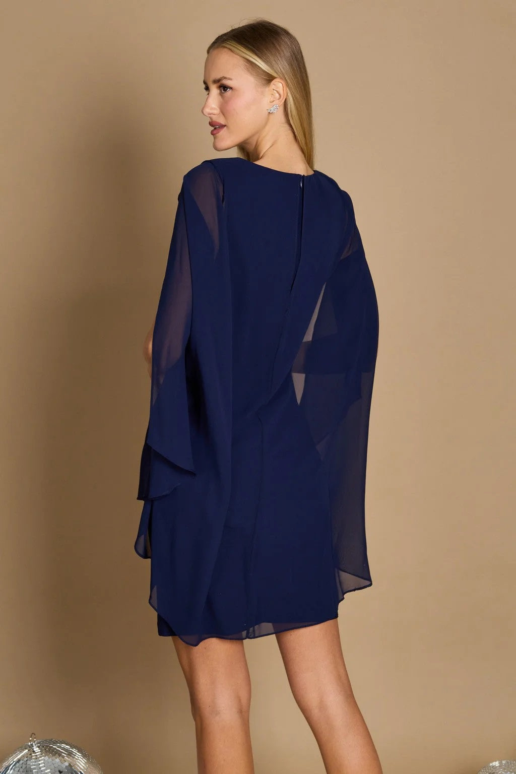 11145 Navy, chiffon, knee length dress with attached cape.