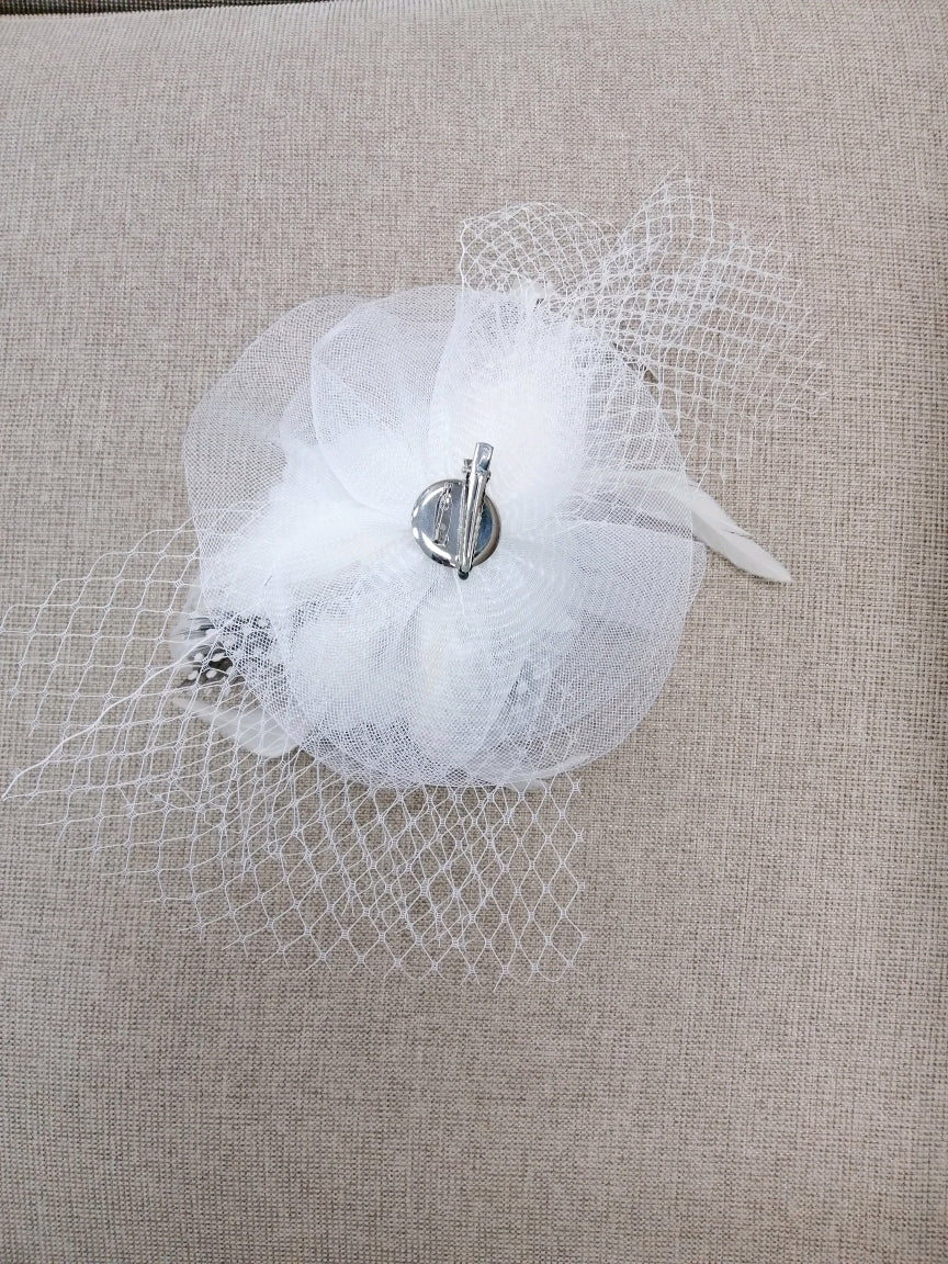 BBFAC2 Classic, elegant white fascinator with central flower, feathers and net.