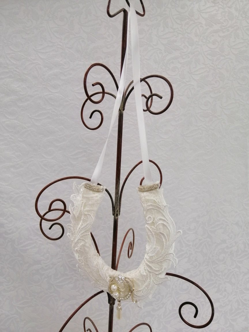 BBHS24 white satin bridal horseshoe with pearls and light ivory lace embellishments.