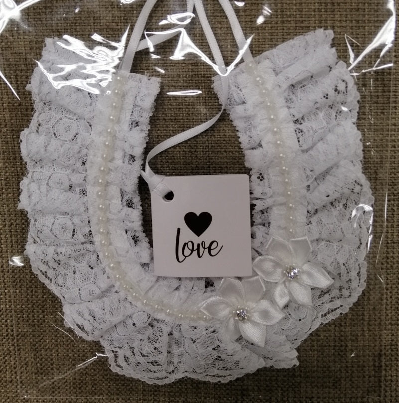 BBHS40 Ivory lace bridal horseshoe with pearls and satin flowers.