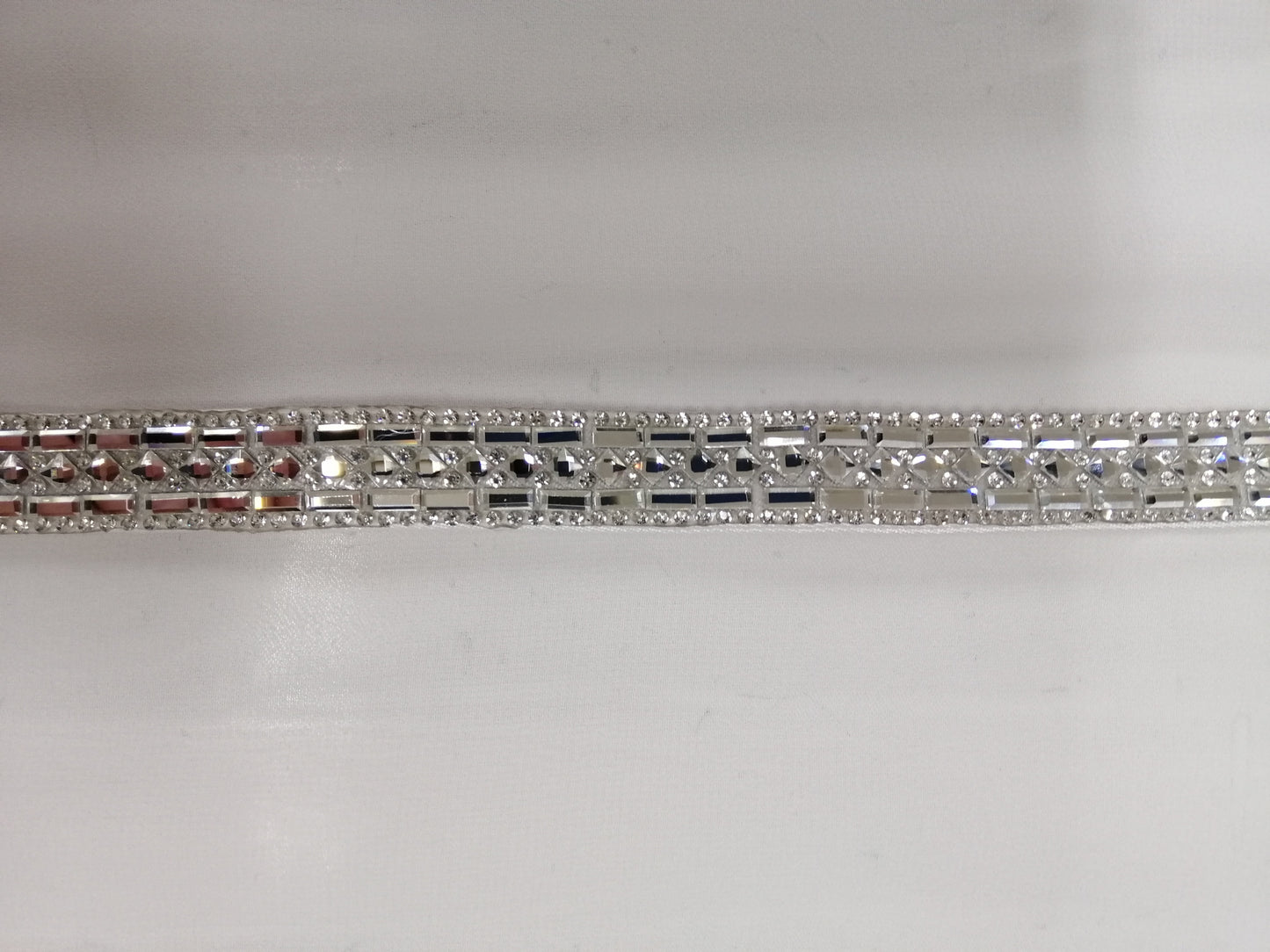 BBB8 fitted belt fully diamante and lined with satin. Closed with hooks size 10