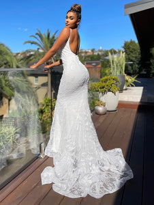 71557. Stunning square neckline. Fit and flare fully beaded.