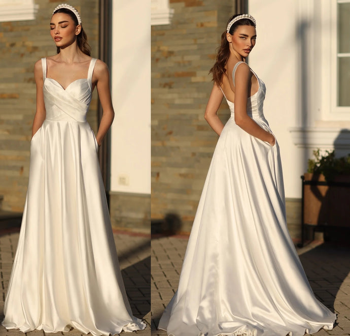 71611  Ivory, satin A line with pockets and straps. Size 18