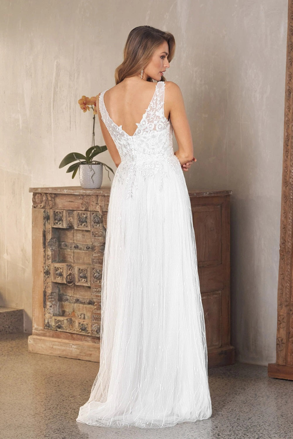 71730 V neckline. Low V back beaded bodice. Soft tulle skirt