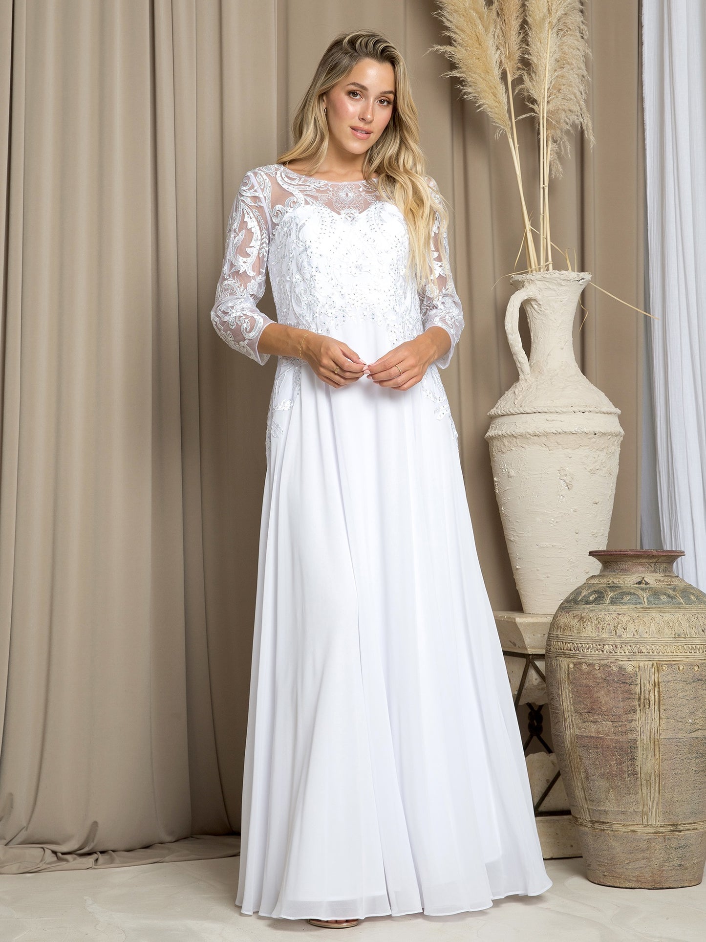 71757 Floaty chiffon skirt with 3/4 sleeve and beaded detail on bodice.