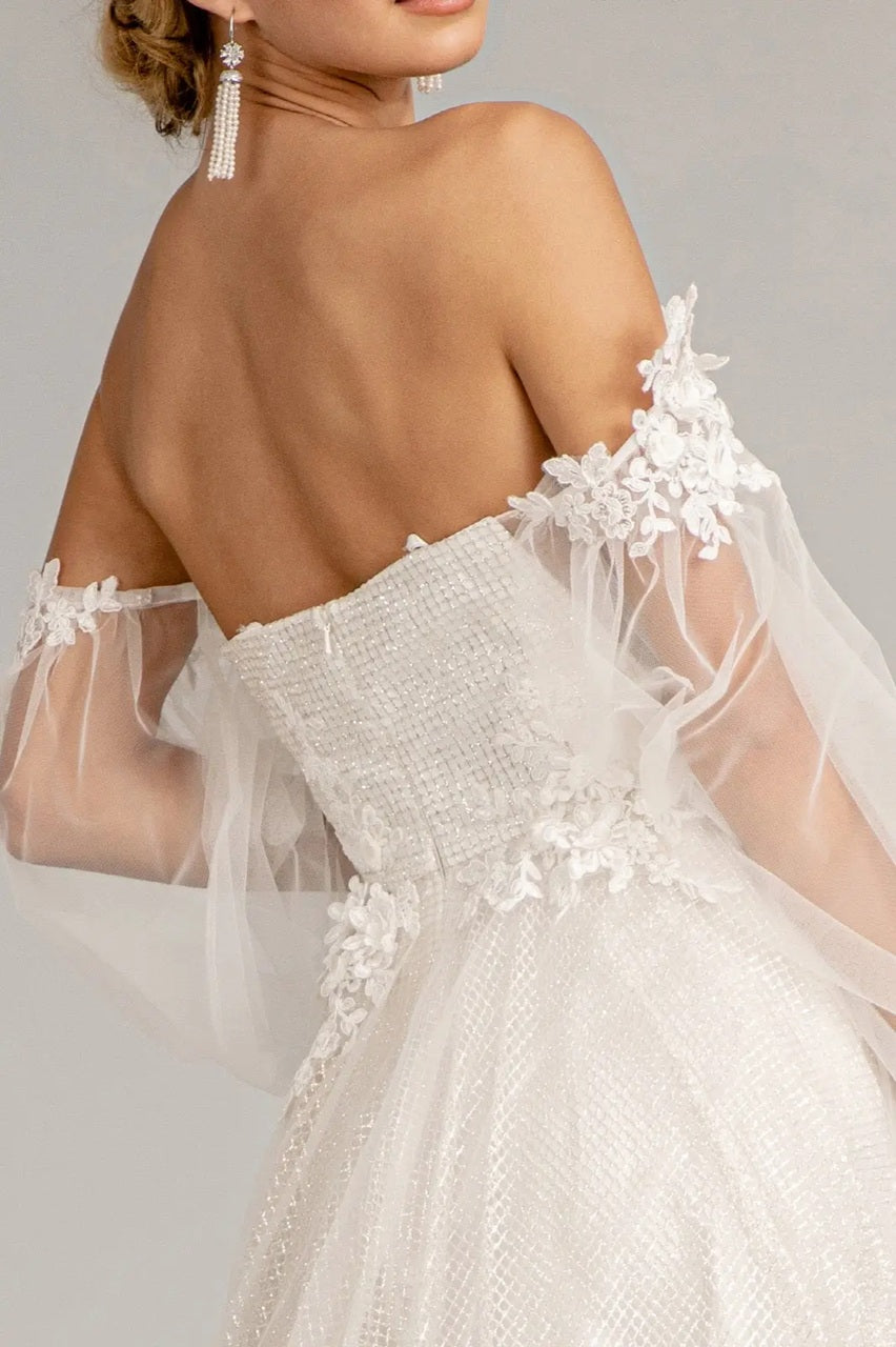 72053 A floral-embellished A-line gown. Detachable sleeves