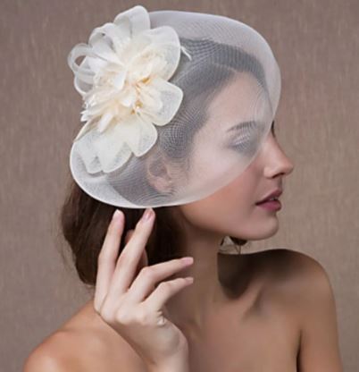 FAC1003CR Classic, cream fascinator with central flower and mesh.