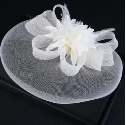 FAC1003CR Classic, cream fascinator with central flower and mesh.