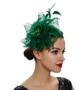 FAC1004EG Classic, green fascinator with central flower, feathers and net.