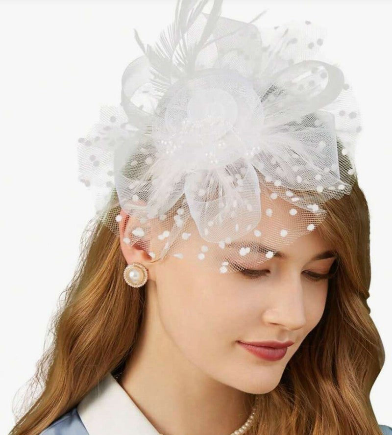 FAC1004W Classic, white fascinator with central flower, feathers and net.
