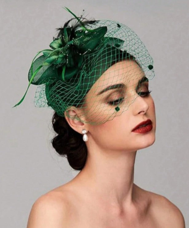 FAC1005GR Classic, green fascinator with birdcage net, flower and feather detail