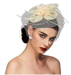 FAC1005 Classic, cream fascinator with birdcage net, flower and feather detail