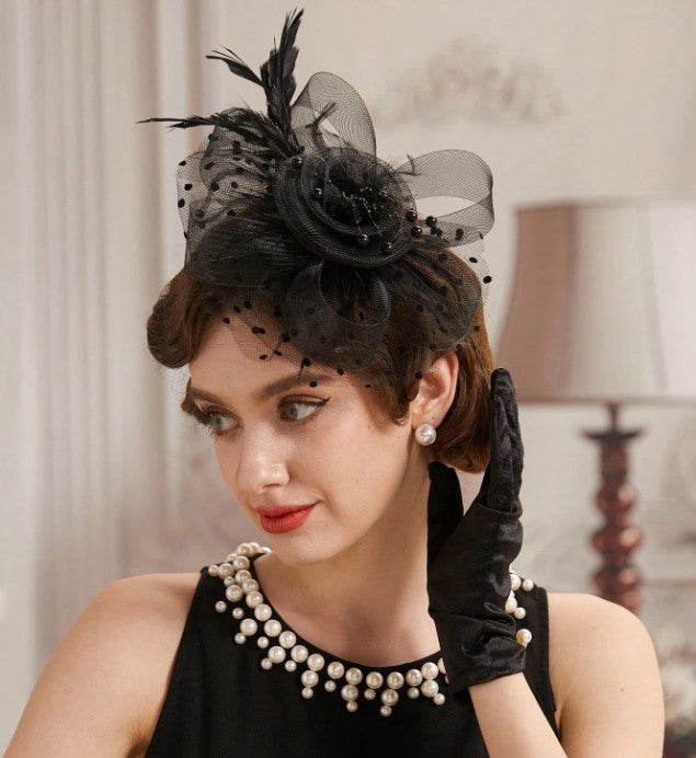 FAC1008B Classic, black fascinator with central flower, feathers and net