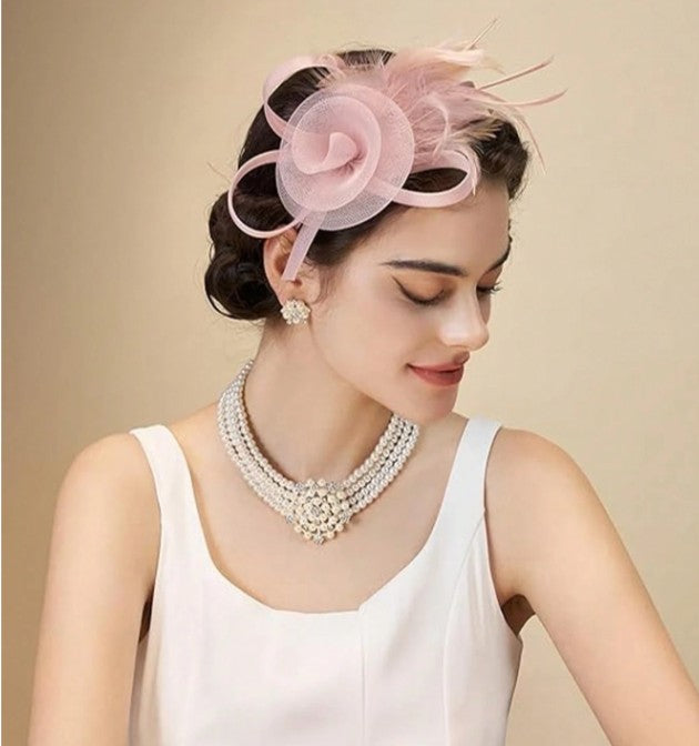 FAC1010BL Classic, blush fascinator with feather detail.