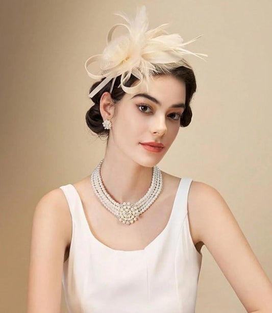 FAC1010CH Classic, champagne fascinator with feather detail.