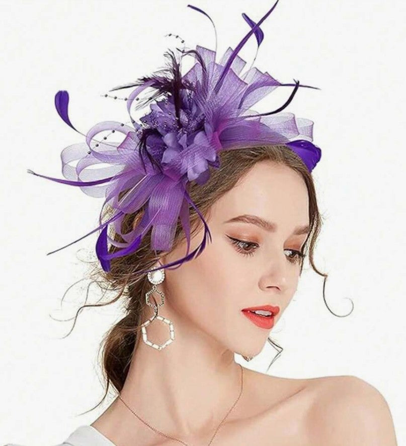 FAC10115P Classic, purple fascinator with central flower and feathers.