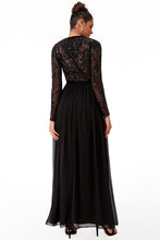 10957. Black chiffon maxi with long sleeves and sequin bodice. Size 10.