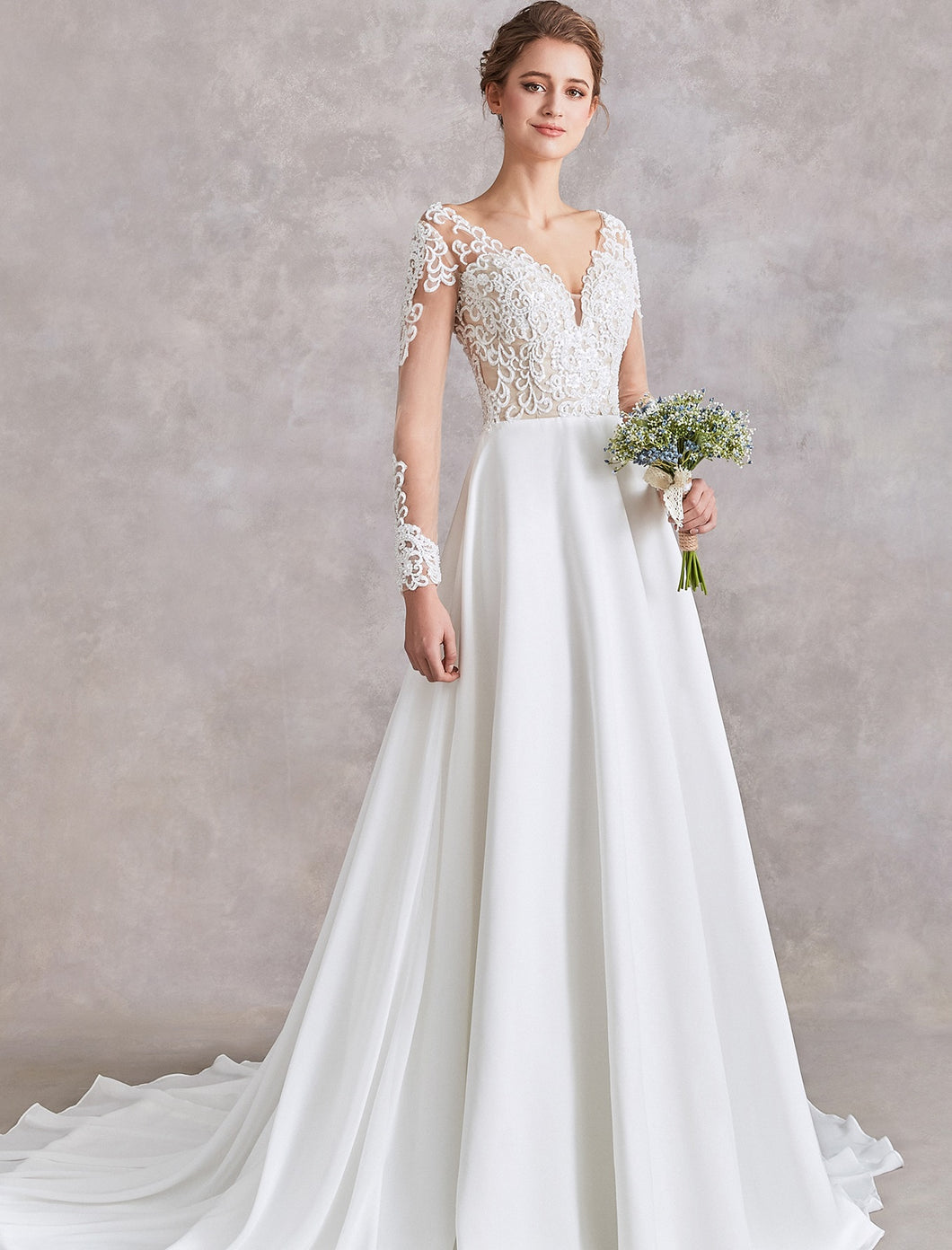 71122  Beautiful bohemian wedding gown. Features a flowy skirt and beaded top