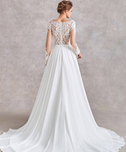 71122  Beautiful bohemian wedding gown. Features a flowy skirt and beaded top