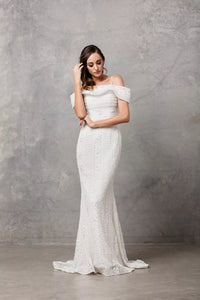 71308 -  Bohemian off shoulder fit and flare in corded aztec lace.