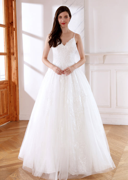 71445 V  Neckline with spaghetti straps. Princess sparkle detailed skirt.