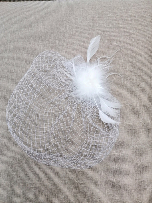 BBFAC4. Dainty, elegant white fascinator with soft feather detail.