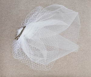 BBFAC6 Elegant off white fascinator with net and soft tulle.