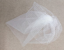 BBFAC6 Elegant off white fascinator with net and soft tulle.