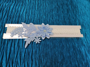 BBG3 Blue and white lace bridal garter with applique flowers.