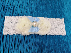 BBG5 Blue and white stretch lace bridal garter with applique flowers and blue satin ribbon
