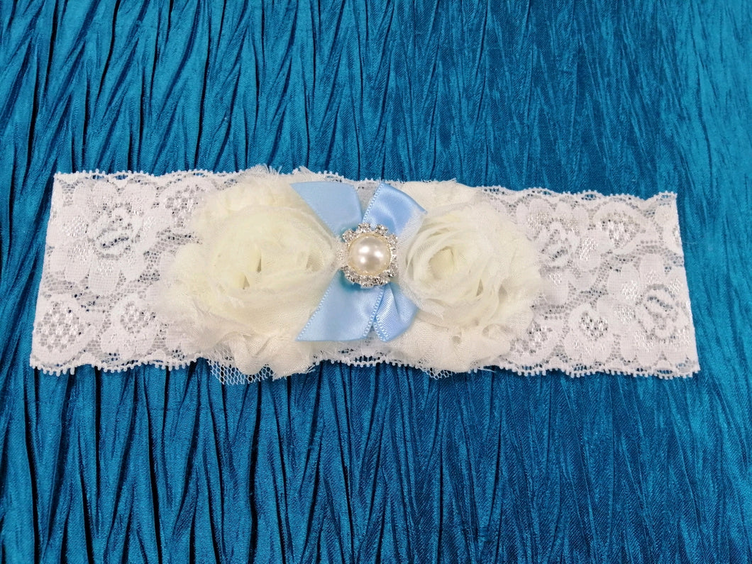 BBG5 Blue and white stretch lace bridal garter with applique flowers and blue satin ribbon
