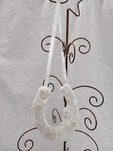 BBHS19 white satin bridal horseshoe with pearls and light ivory lace embellishments.