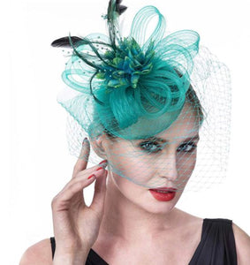 FAC100G Classic, green fascinator with central flower, feathers and net.