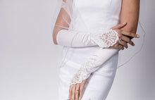 BBGV1 Satin elbow length finger-less glove. Embellished with pearls and sequins.