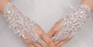 BBGV2. Lace wrist length finger-less glove. Embellished with pearls and sequins