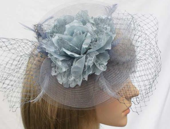 BBFAC2G Classic, elegant grey fascinator with central flower, feathers and net.